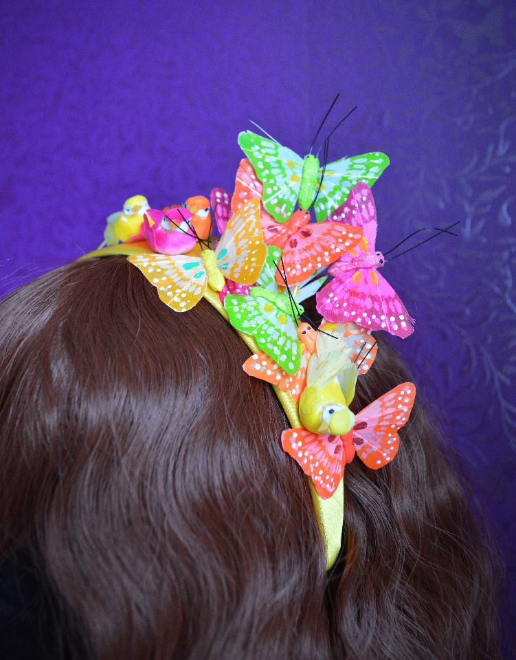 IMAGE - Yellow satin headband with pink, orange, yellow and green butterflies and birds.