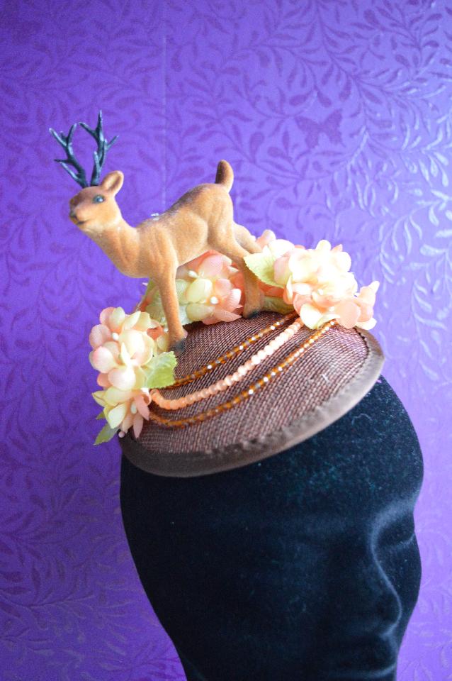 IMAGE - Brown sinamay fascintor with deer and orange vintage silk flowers. Finished with brown and orange glass beads. Fixes to hair with a comb.