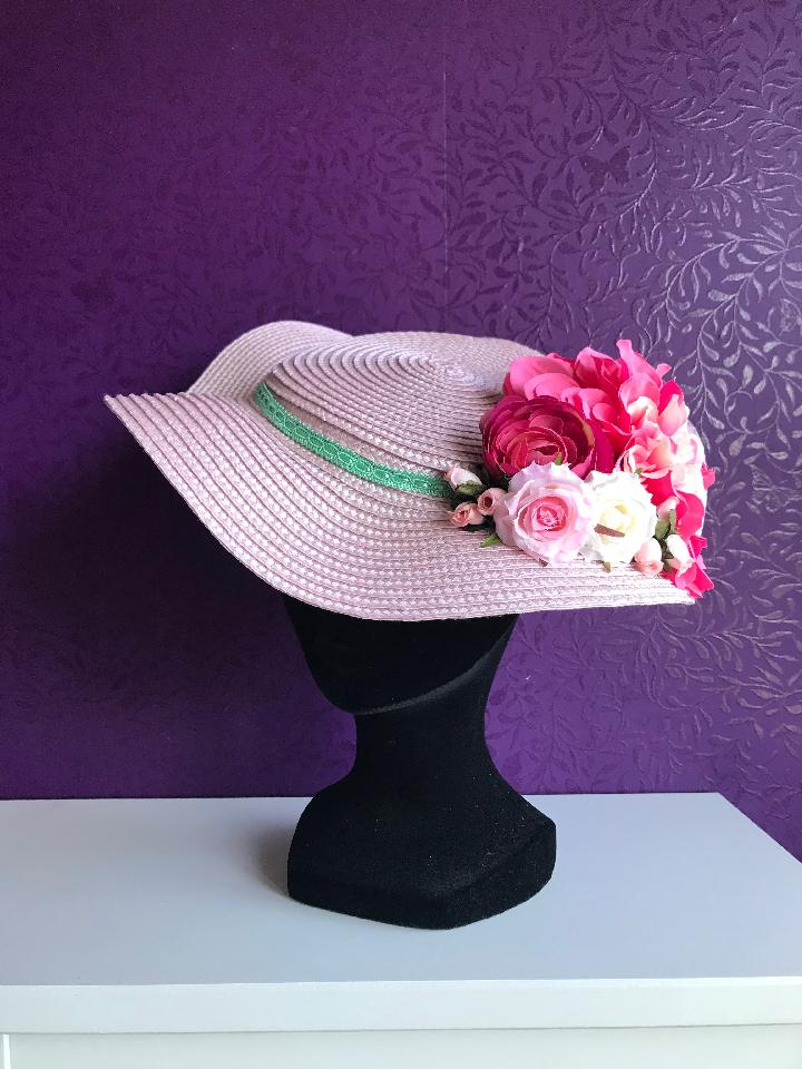 IMAGE - Flat pink straw summer hat, decorated with mint trim and various pink and white flowers. Stays on with an elastic.