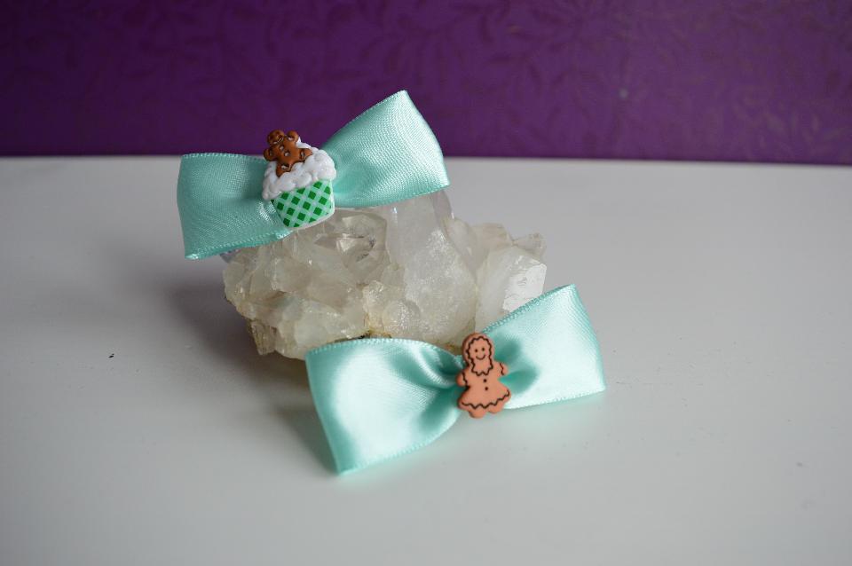 IMAGE - Set of two light blue satin bow hairpins with gingerbreadmen.