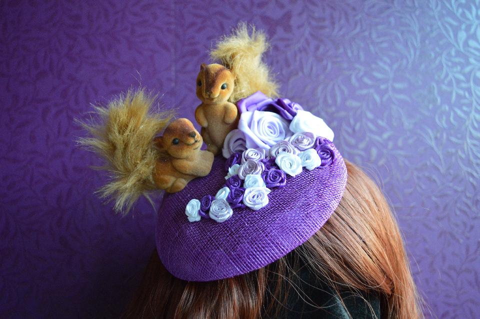 IMAGE - Purple sinamay fascinator with cute squirrels and purple, lilac and white ribbon roses.
Fixes to hair with a comb. 