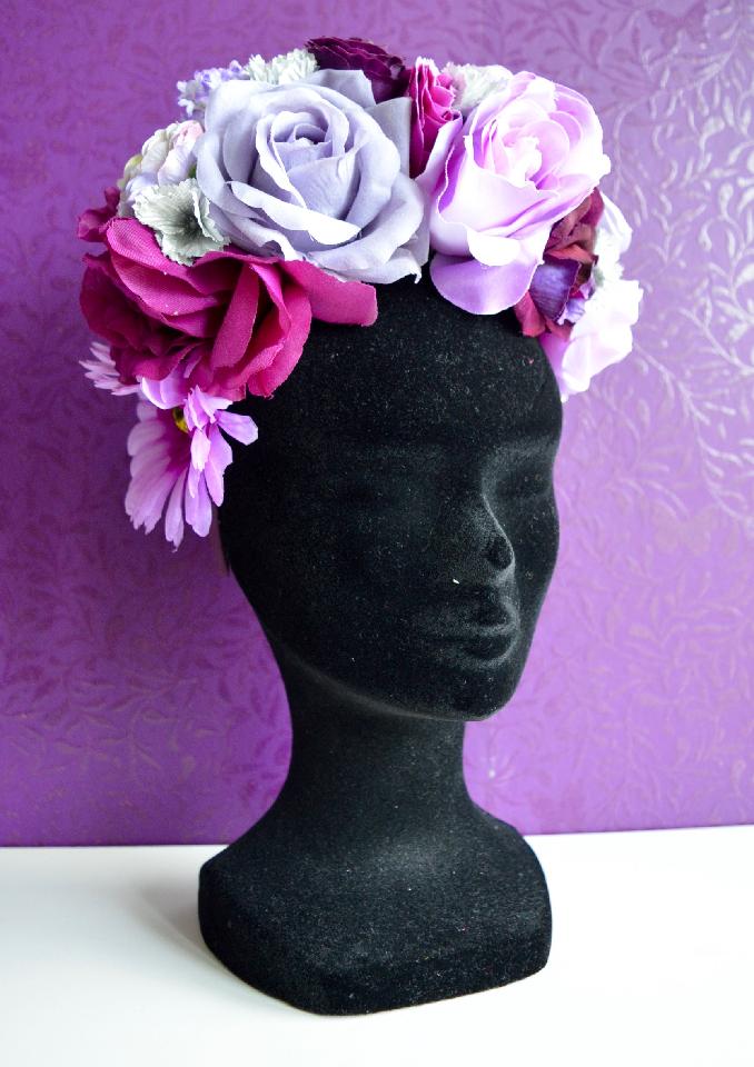 IMAGE - Dark green satin head heavily covered in purple and silver flowers of various shades. 