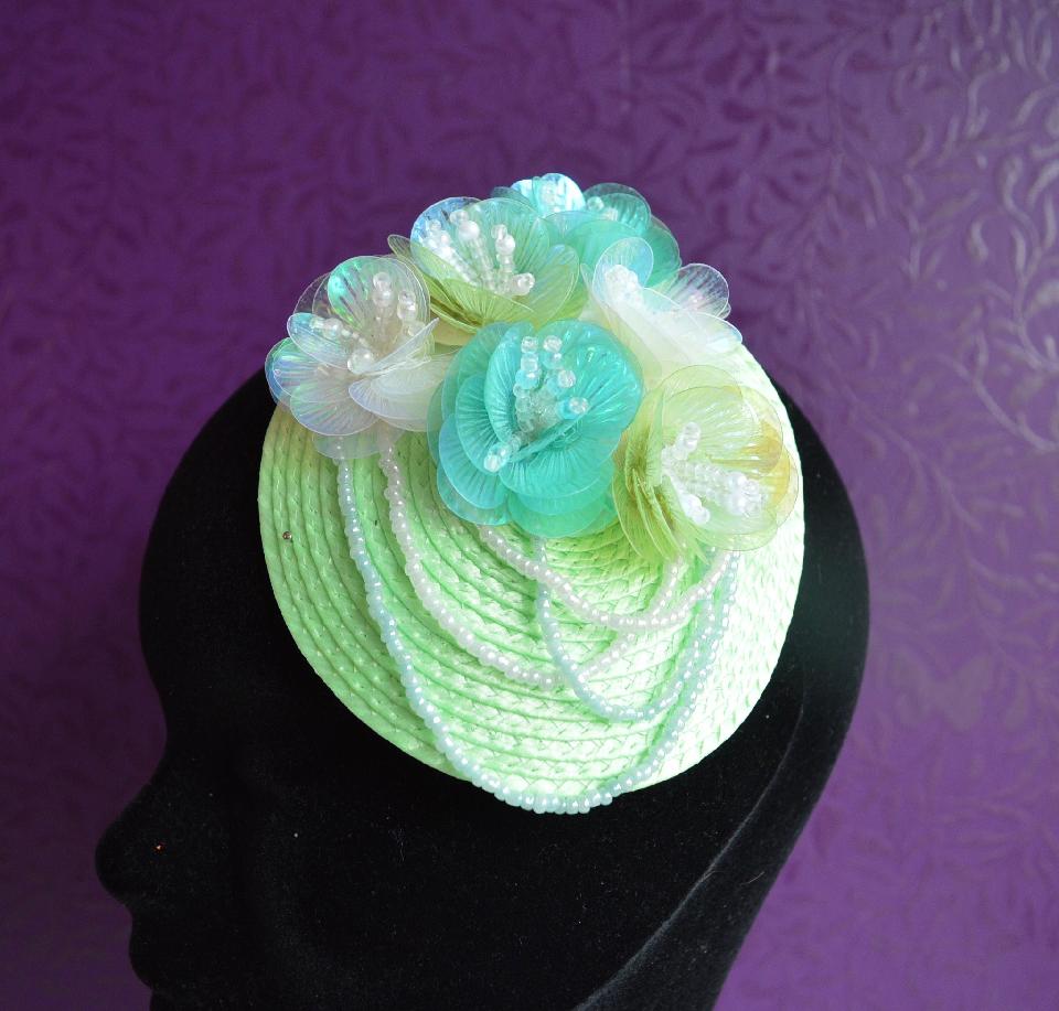 IMAGE - Light green straw fascinator with sequin flowers and beads in shades of green and white. Fixes to hair with a comb.