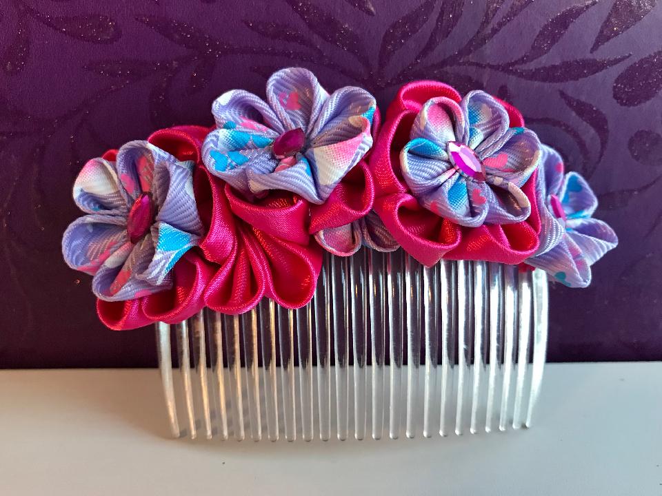 IMAGE - Pink and lilac handfolded kanzashi flower comb, finished with pink rhinestones.